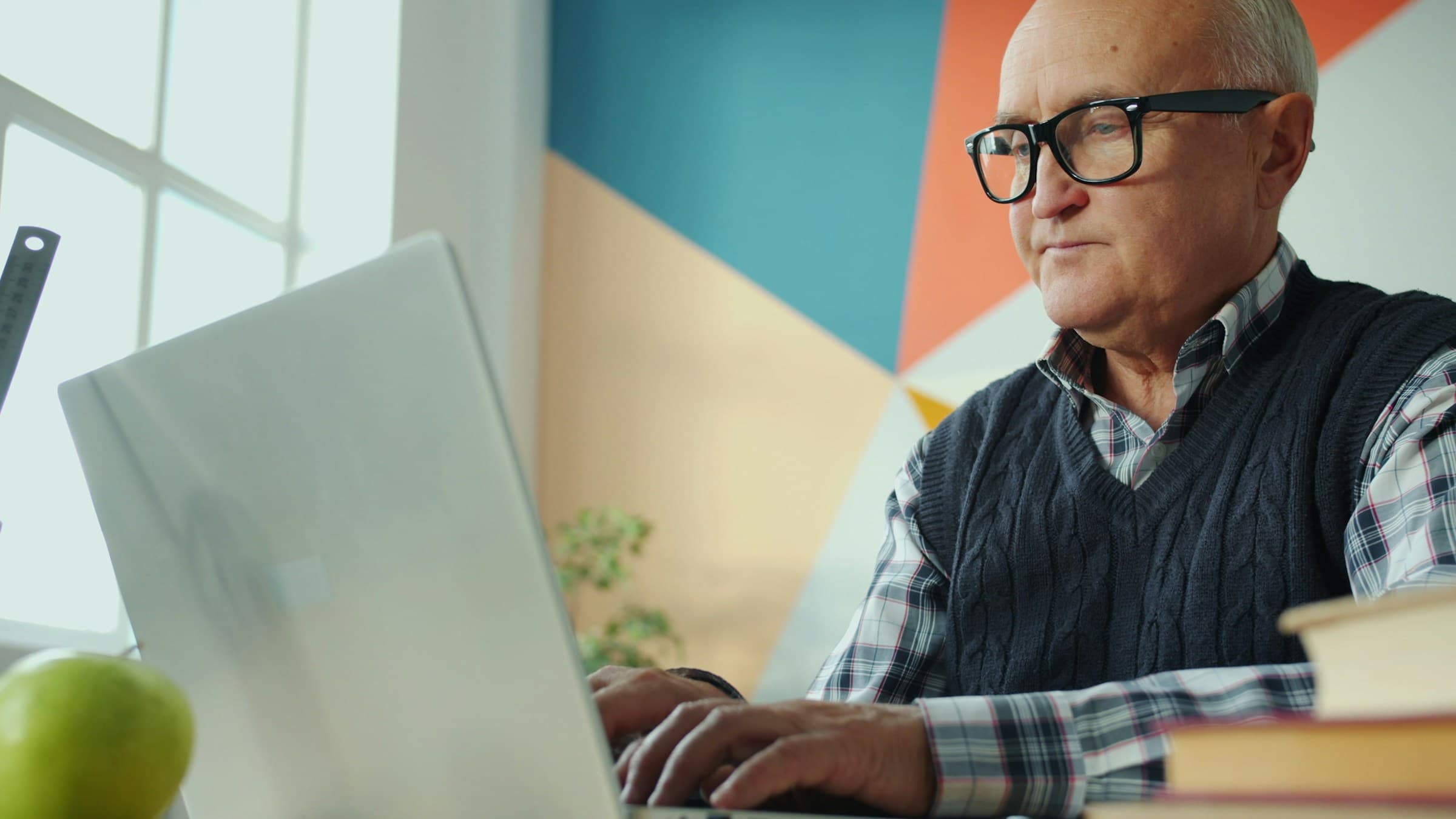 An experienced developer working on a laptop